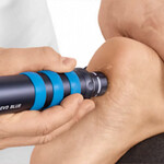 Chiropractor applying radial shockwave therapy to a patient’s heel for plantar fasciitis or neuropathy treatment at Spine Align Chiropractic & Wellness in Huntsville.