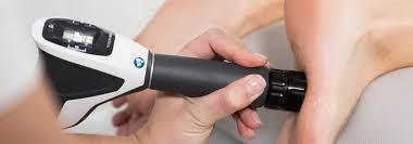 Shockwave therapy device used on the foot for non-invasive plantar fasciitis care.