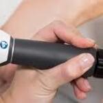 Shockwave therapy device used on the foot for non-invasive plantar fasciitis care.