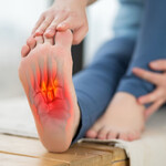 Photo of foot pain from plantar fasciitis, with visual pain overlay on the sole.