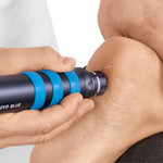 Radial shockwave therapy being applied to the heel as part of plantar fasciitis treatment.