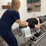 Chiropractor Adjusting a Patient