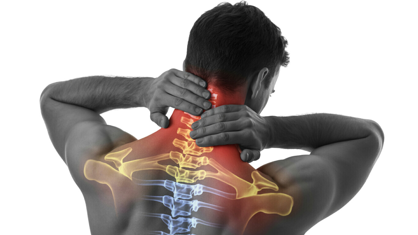 Man grabs pain in neck