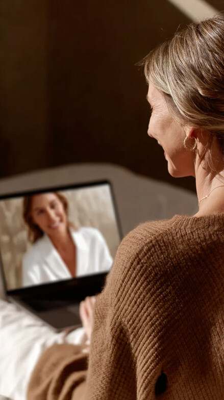 woman speaking to telehealth practitioner