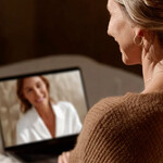 woman speaking to telehealth practitioner