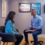Doctor discussing a chiropractic treatment plan with a patient